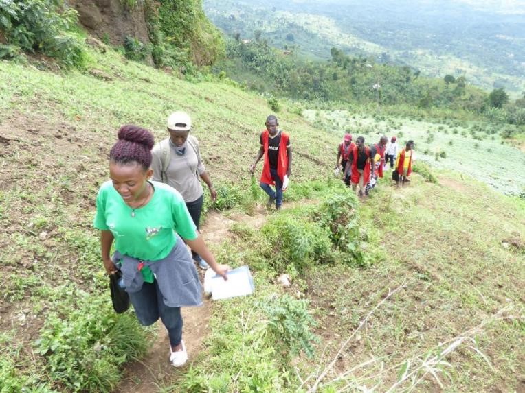 Planting trees during a field trip to Kapcwai, Kapchorwa